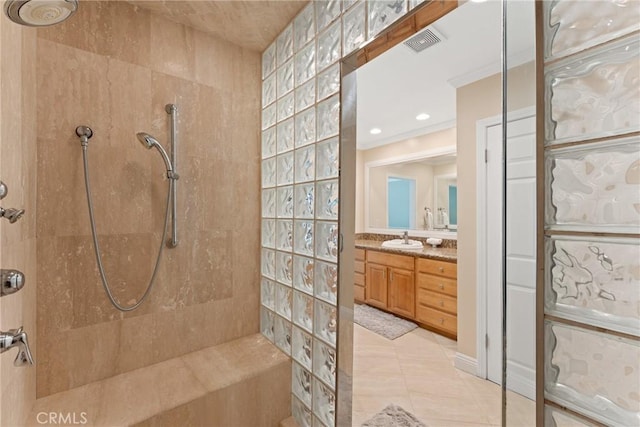 full bath featuring vanity, visible vents, a walk in shower, and tile patterned floors