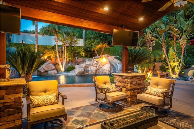 view of patio / terrace with an outdoor fire pit