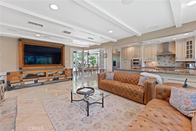 living room featuring visible vents, recessed lighting, and beamed ceiling