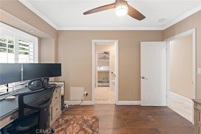 home office featuring ornamental molding, a ceiling fan, baseboards, and dark wood finished floors
