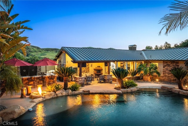 outdoor pool featuring a patio area