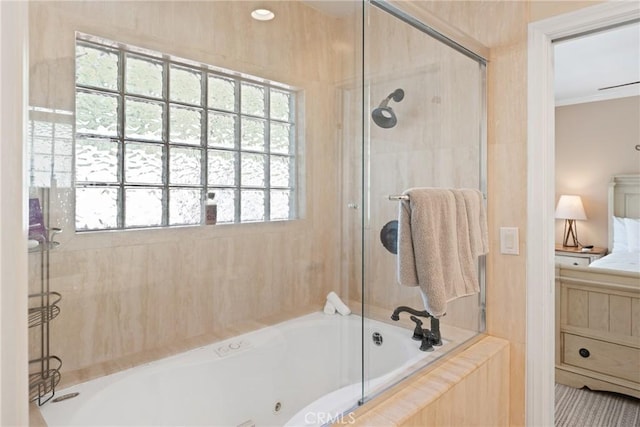 bathroom with a tile shower, a bath, and ornamental molding