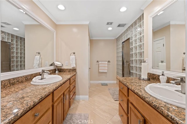 bathroom with visible vents, recessed lighting, ornamental molding, and a sink