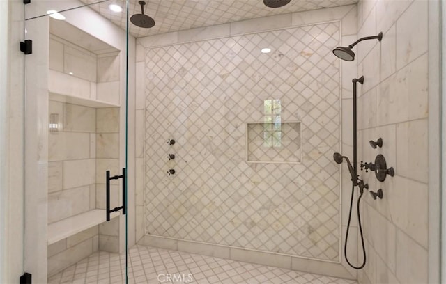 bathroom featuring a shower stall and tile patterned floors