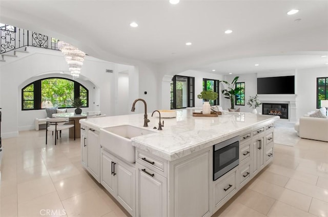 21 Observatory, Newport Coast, CA 92657 - kitchen featuring stainless steel microwave, open floor plan, healthy amount of natural light, a large island, and recessed lighting
