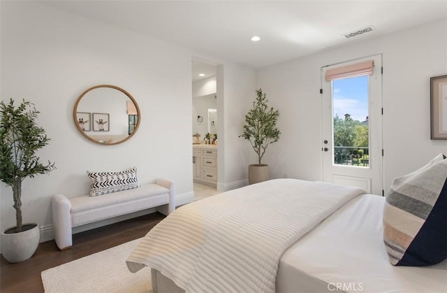 bedroom with recessed lighting, access to exterior, visible vents, wood finished floors, and ensuite bathroom