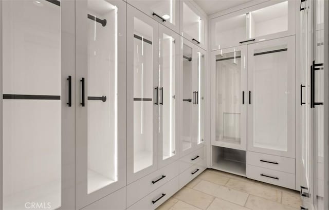 mudroom featuring marble finish floor