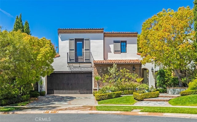 21 Observatory, Newport Coast, CA 92657 - mediterranean / spanish-style house featuring a tile roof, an attached garage, stucco siding, and concrete driveway