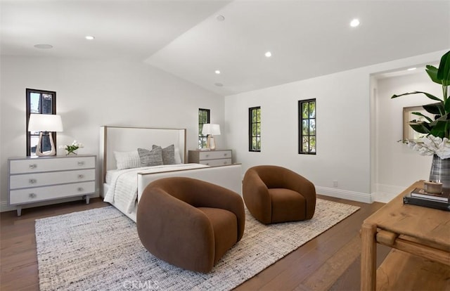 bedroom featuring wood finished floors, recessed lighting, vaulted ceiling, and baseboards