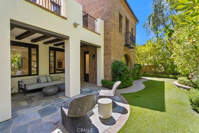 exterior space featuring a balcony and a patio