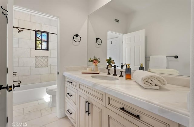 bathroom with visible vents, shower / bathtub combination, toilet, vanity, and marble finish floor