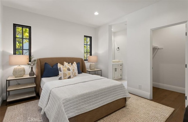 21 Observatory, Newport Coast, CA 92657 - bedroom featuring wood finished floors, a spacious closet, multiple windows, recessed lighting, and ensuite bathroom