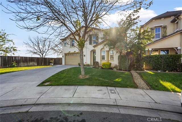 view of front of property with driveway, stucco siding, a front lawn, and a garage