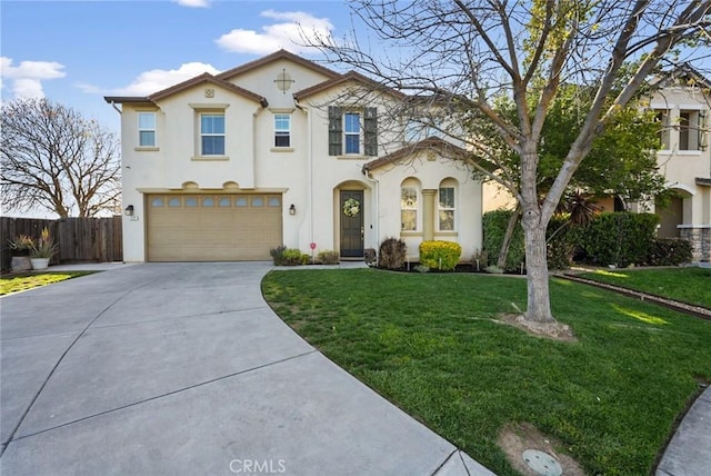 mediterranean / spanish-style home with stucco siding, a front yard, fence, an attached garage, and driveway
