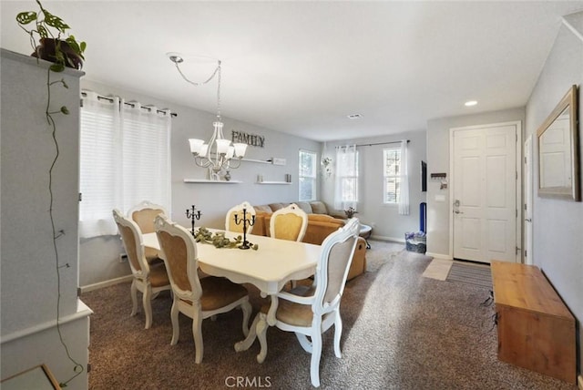 carpeted dining room with recessed lighting, baseboards, and an inviting chandelier
