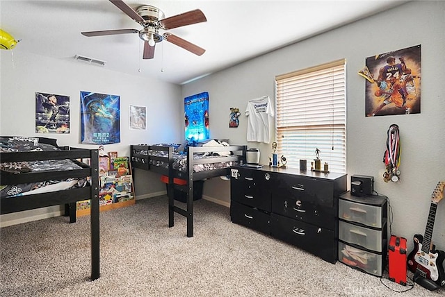 bedroom featuring visible vents, baseboards, ceiling fan, and carpet