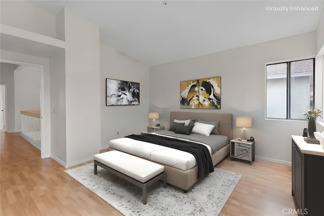 15767 San Roque Rd, Fontana, CA 92337 - bedroom with light wood finished floors, baseboards, and high vaulted ceiling