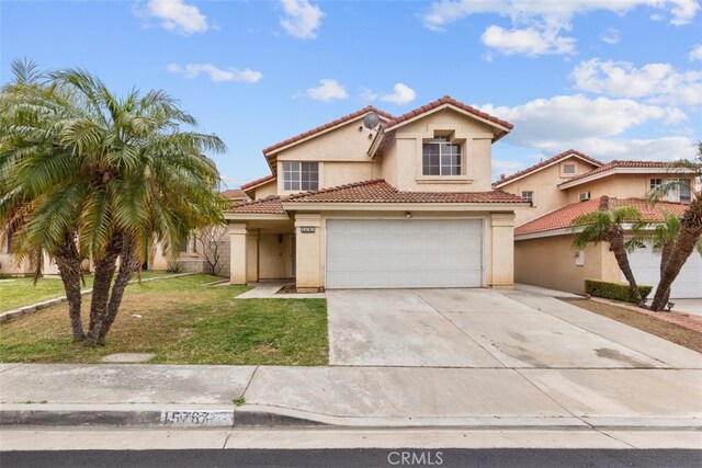15767 San Roque Rd, Fontana, CA 92337 - mediterranean / spanish house with driveway, a tiled roof, and stucco siding
