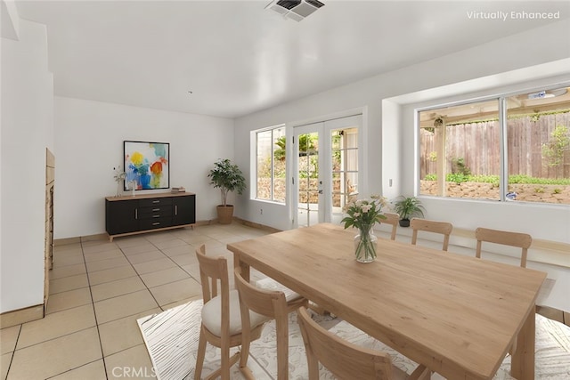 15767 San Roque Rd, Fontana, CA 92337 - dining area with light tile patterned flooring, baseboards, and french doors