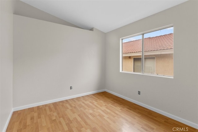 15767 San Roque Rd, Fontana, CA 92337 - unfurnished room featuring wood finished floors, baseboards, and lofted ceiling