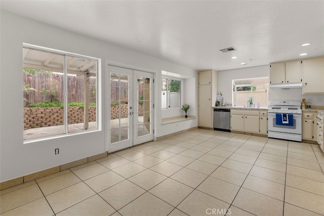 15767 San Roque Rd, Fontana, CA 92337 - kitchen featuring white range with gas cooktop, light countertops, french doors, plenty of natural light, and recessed lighting