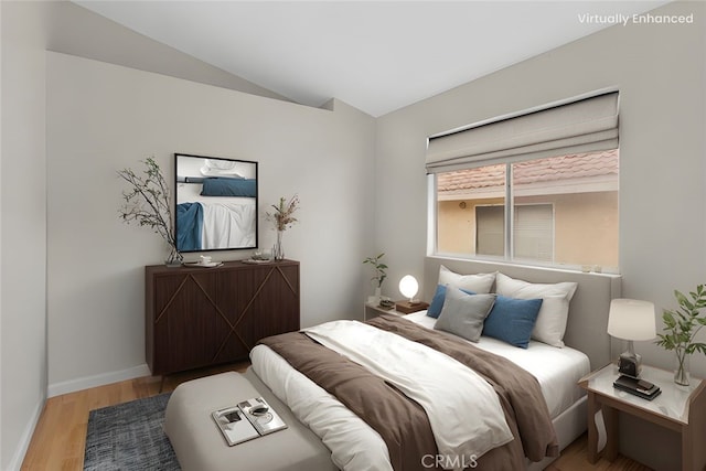 15767 San Roque Rd, Fontana, CA 92337 - bedroom featuring wood finished floors, baseboards, and vaulted ceiling