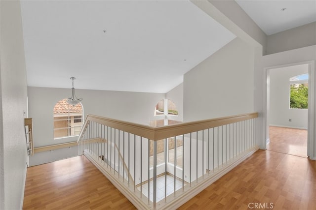 15767 San Roque Rd, Fontana, CA 92337 - corridor featuring an upstairs landing and wood finished floors