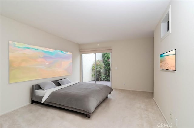 bedroom featuring access to outside, light carpet, and baseboards