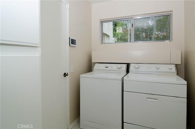 laundry area featuring washer and dryer and laundry area