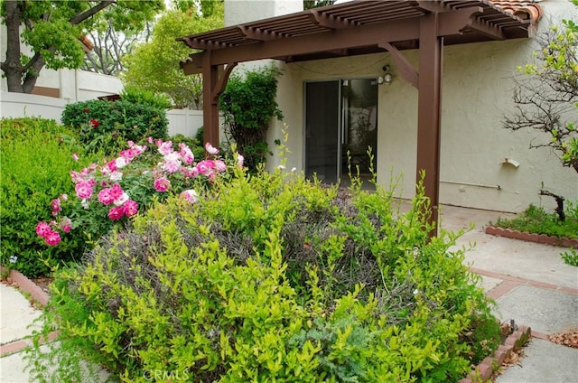 view of yard featuring a pergola and fence