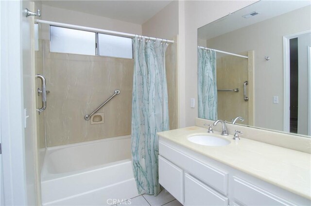 bathroom featuring visible vents, vanity, shower / bath combination with curtain, and tile patterned flooring