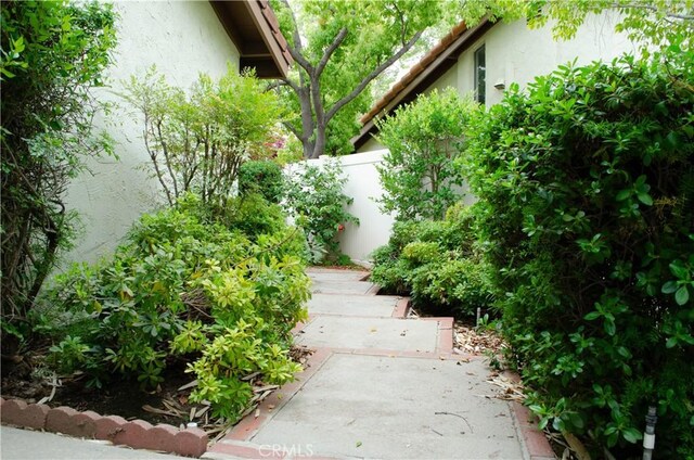 view of yard featuring fence and a patio area