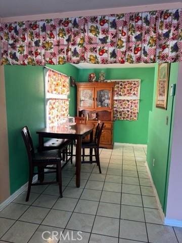 15920 Mission Ave, Fontana, CA 92335 - dining area featuring light tile patterned floors and baseboards