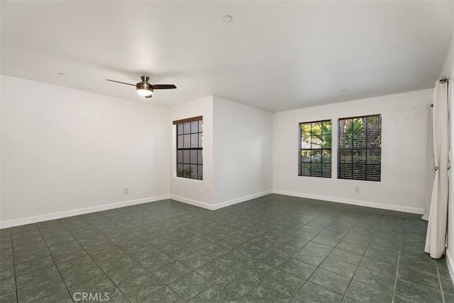 1044 Calle Del Cerro Unit 301, San Clemente, CA 92672 - spare room featuring baseboards and a ceiling fan