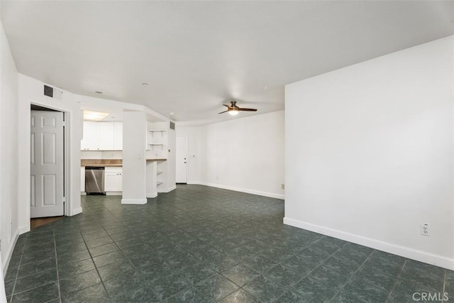 1044 Calle Del Cerro Unit 301, San Clemente, CA 92672 - unfurnished living room with visible vents, baseboards, and a ceiling fan