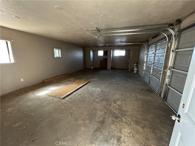 garage featuring concrete block wall