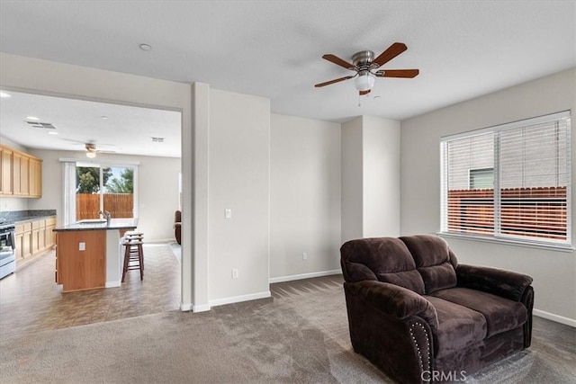 930 Travertine Way, Atwater, CA 95301 - sitting room featuring baseboards, carpet floors, and ceiling fan