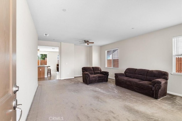 930 Travertine Way, Atwater, CA 95301 - carpeted living area featuring visible vents, baseboards, and a ceiling fan