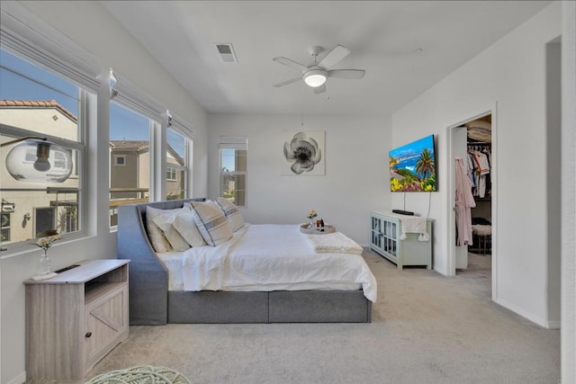 1132 Cherry Tree Ln, Vista, CA 92084 - bedroom featuring light carpet, a walk in closet, and ceiling fan