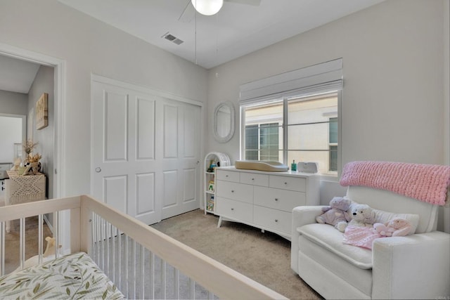 1132 Cherry Tree Ln, Vista, CA 92084 - bedroom featuring light carpet, a closet, a crib, and a ceiling fan