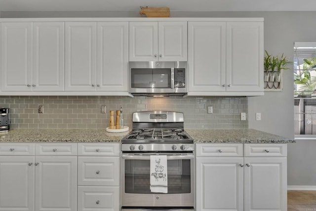 1132 Cherry Tree Ln, Vista, CA 92084 - kitchen featuring stainless steel appliances and white cabinets