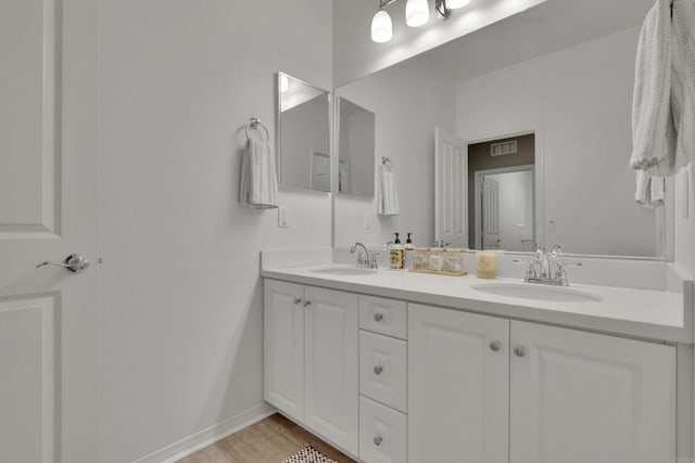 1132 Cherry Tree Ln, Vista, CA 92084 - full bath featuring double vanity and wood finished floors