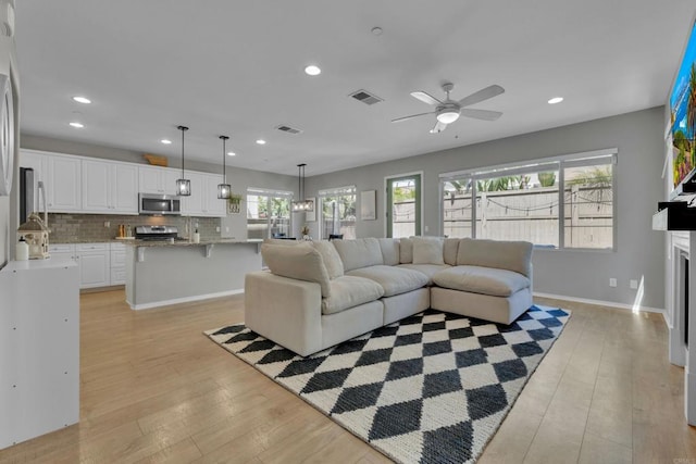 1132 Cherry Tree Ln, Vista, CA 92084 - living area with light wood-style flooring, ceiling fan, and recessed lighting