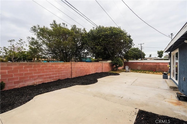 view of patio with a fenced backyard