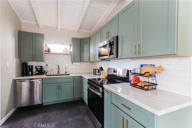 kitchen featuring beam ceiling, stainless steel appliances, green cabinets, and a sink