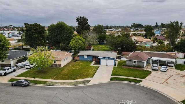 birds eye view of property with a residential view