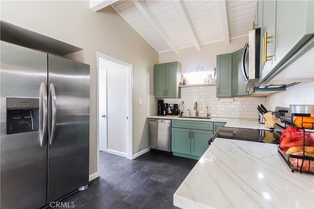 kitchen featuring a sink, stainless steel appliances, decorative backsplash, green cabinets, and open shelves