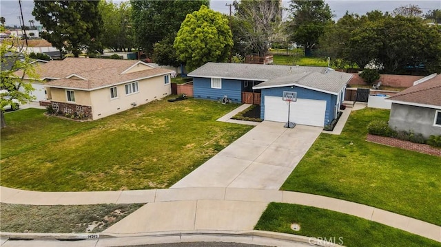 single story home with stucco siding, concrete driveway, a front lawn, and a garage