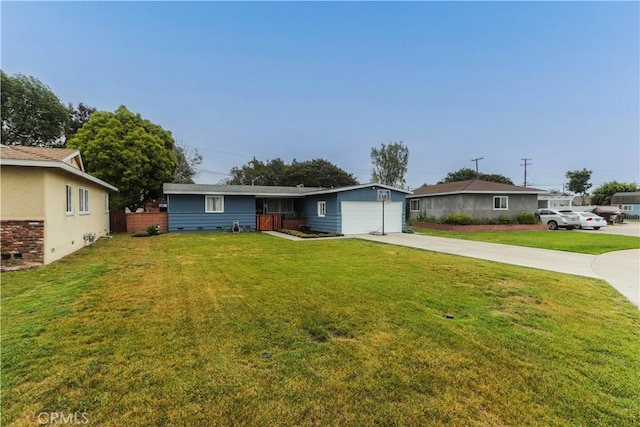 ranch-style house featuring fence, driveway, an attached garage, and a front yard