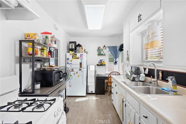 300 W Tujunga Ave, Burbank, CA 91502 - kitchen featuring white appliances, a sink, white cabinetry, and light countertops